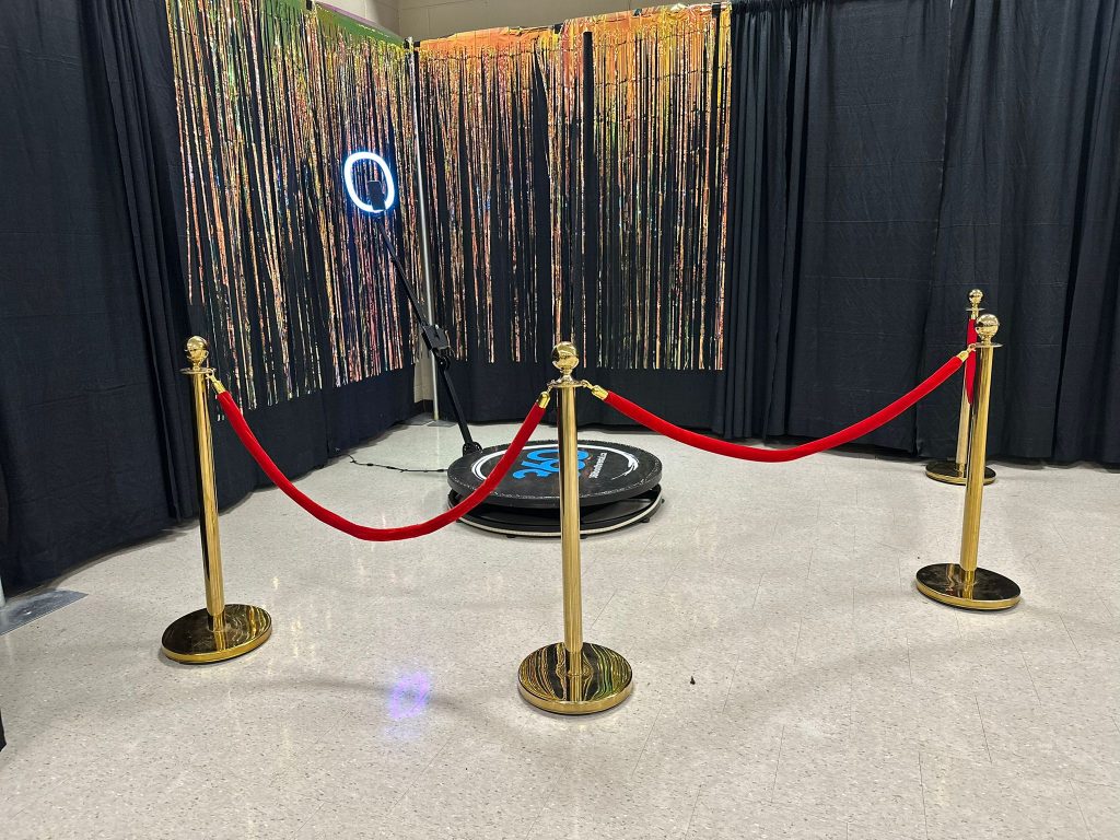 360 video booth with stanchions and streamers