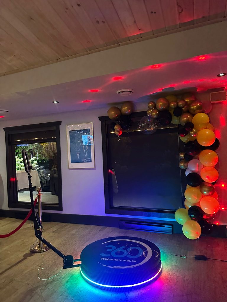 360 video booth with balloon garlands and stanchions