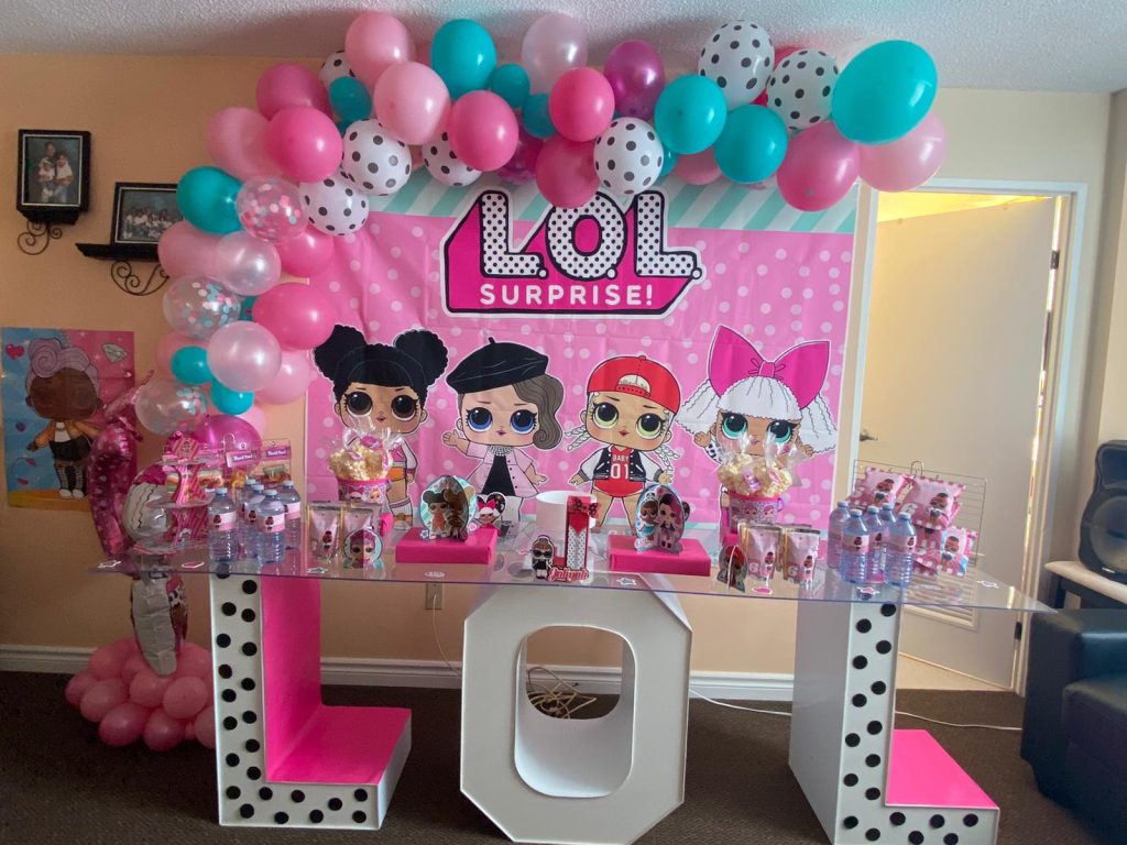 Birthday decor including marquee letters, balloons and a backdrop