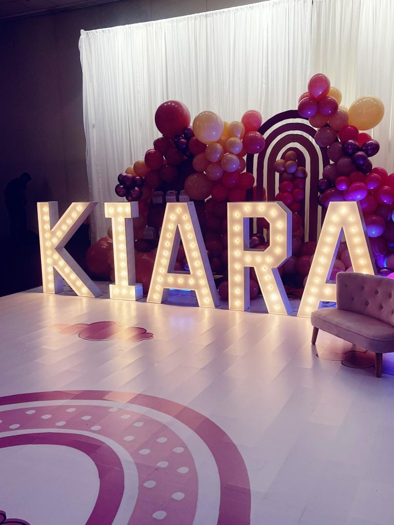 Muskoka marquee letters with balloon garlands and a backdrop